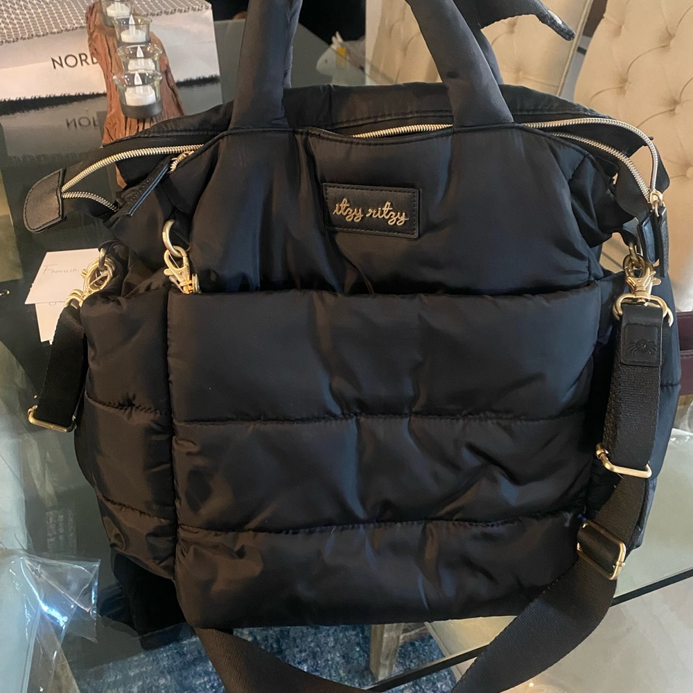 Black diaper bag, great for moms on the go. No tears, no scratches, many pockets